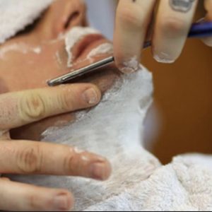 Men’s haircut and shave at barbershop and 2 men’s hair products